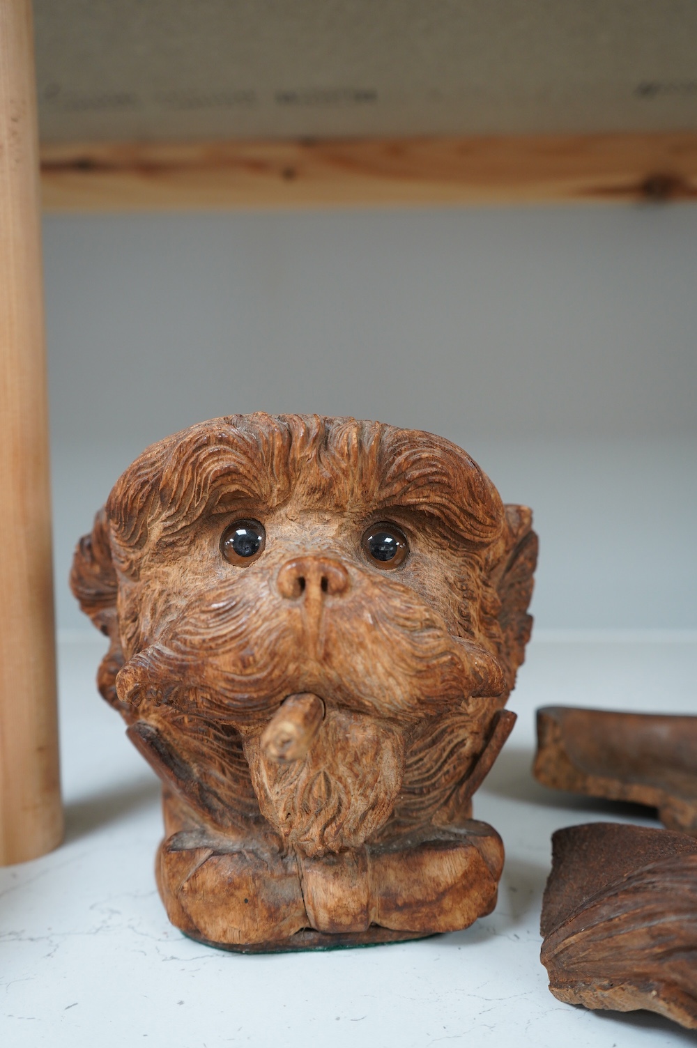 A Black Forest carved ‘terrier’ tobacco jar and cover. Condition - cover poor, jar fair to good